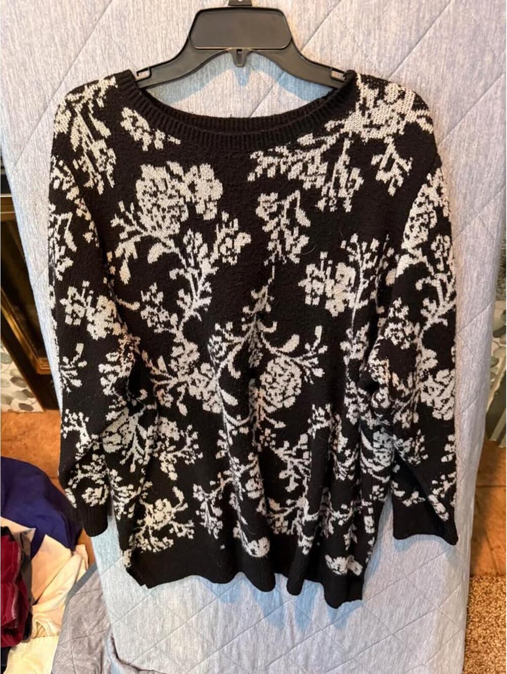 Black sweater with floral design